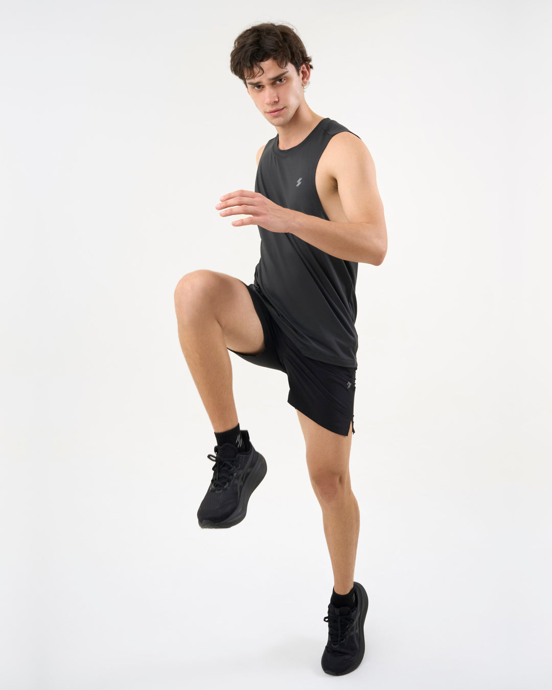 Person wearing a black athletic outfit posing for photoshoot ( person wearing    DCYPHR Men&