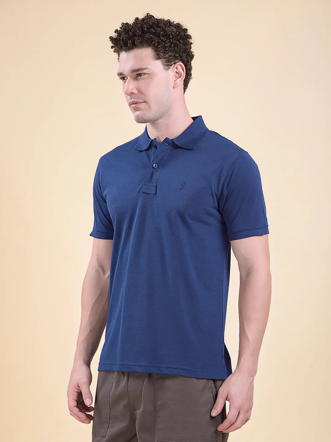Man wearing a blue polo shirt  (DCYPHR Men&
