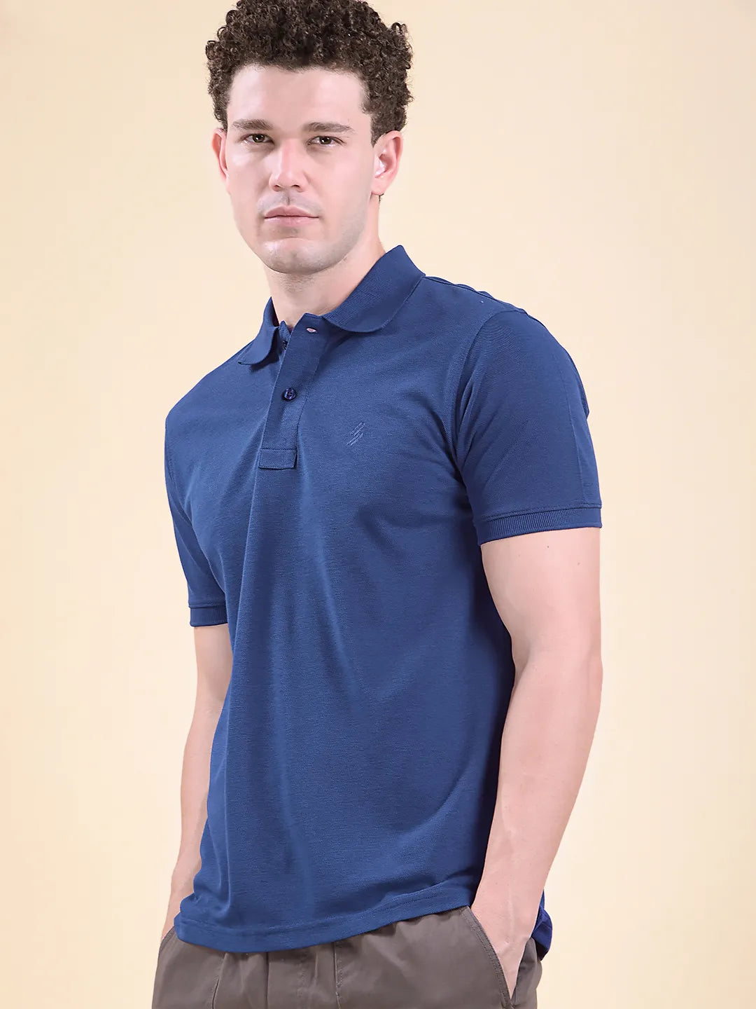 Man wearing a blue polo shirt  (DCYPHR Men&