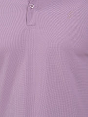 Close-up of a light purple polo t-shirt (DCYPHR Men's Element Polo - Dusk Plum) with a brand logo on the chest.